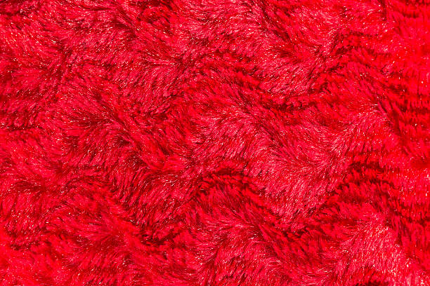 istock red faux fur texture background 532875142
