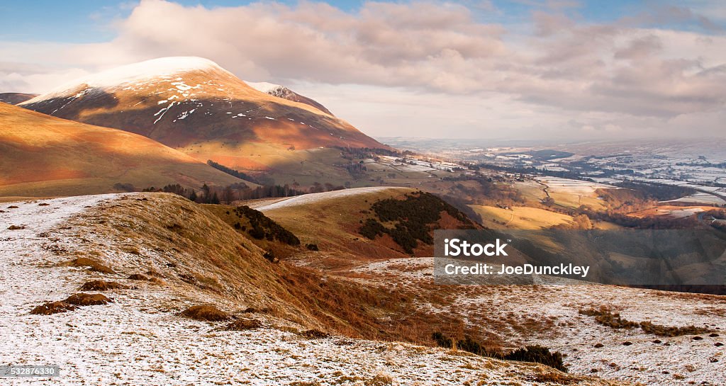 Snow on Latrigg Snow covers the rolling hills of Latrigg and Blencathra mountain in the English Lake District. Blencathra Stock Photo