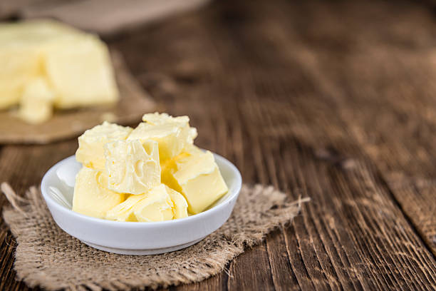 istock Piece of Butter on wooden background (selective focus) 532876376