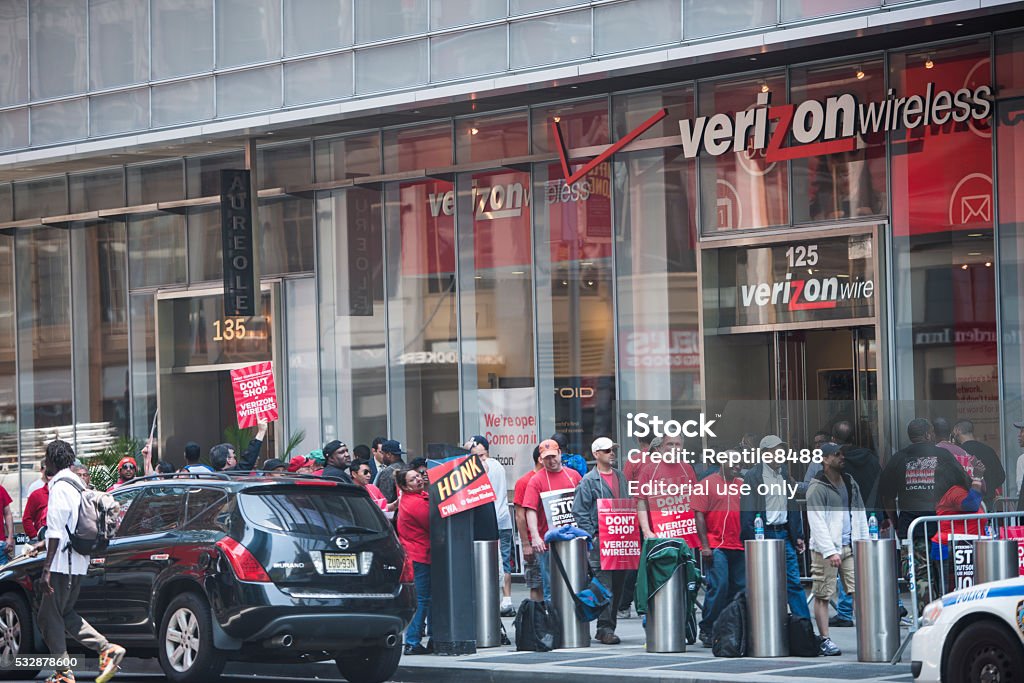 Verizon employees on strike picketing New York, USA - May 20, 2016: A group of picketing verizon employees who are on strike over a contract dispute.  Business Stock Photo