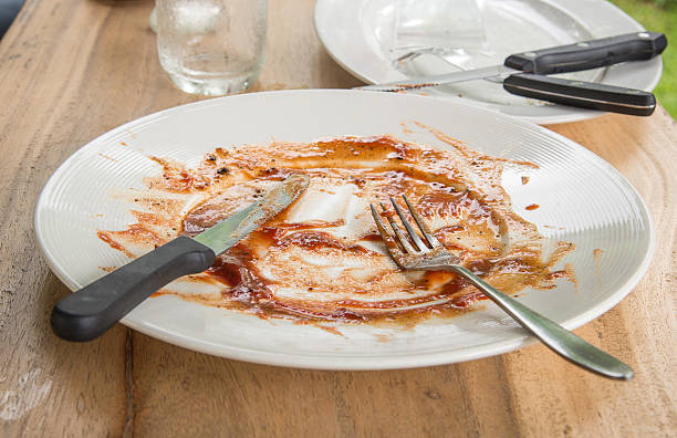 istock Dirt plate,Plate Spaghetti dirty cutlery on wooden table. 532878762