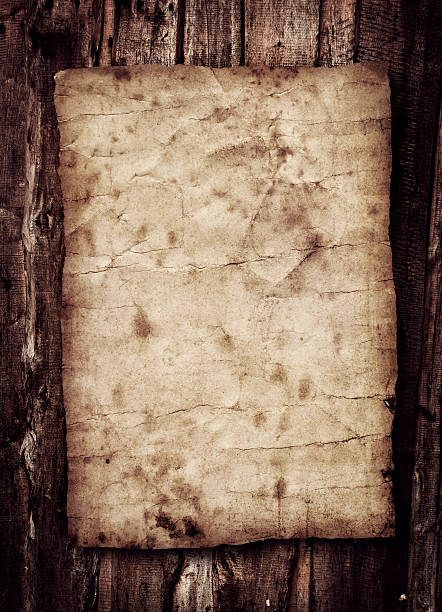 istock Old paper on the wood background 532912553