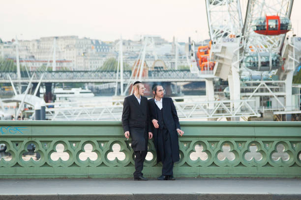 London, United Kingdom - April 24, 2014: two  young traditionally dressed jewish man chatting by Westminster.