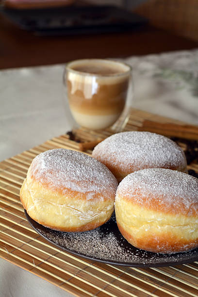 istock Donuts and coffee on the brown plate on the table 532915869