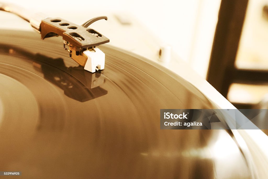 Vinyl record player Closeup of needle on spinning vinyl record 2015 Stock Photo