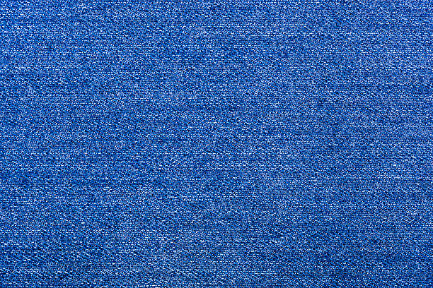 istock background texture of blue, rough denim close-up 532917517