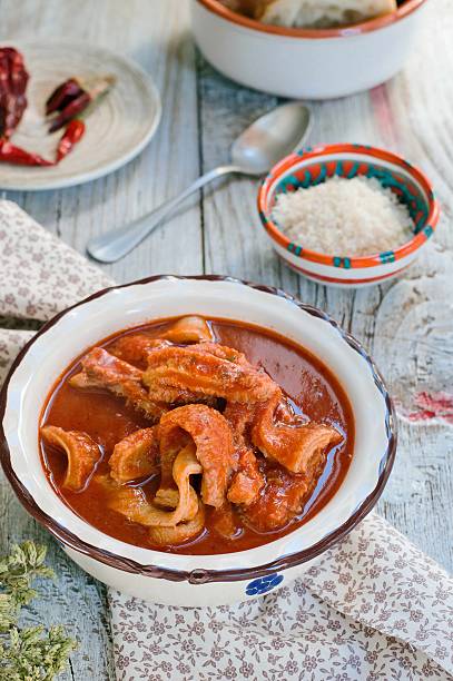 Tripe soup with tomatoes. Italian cuisine. stock photo