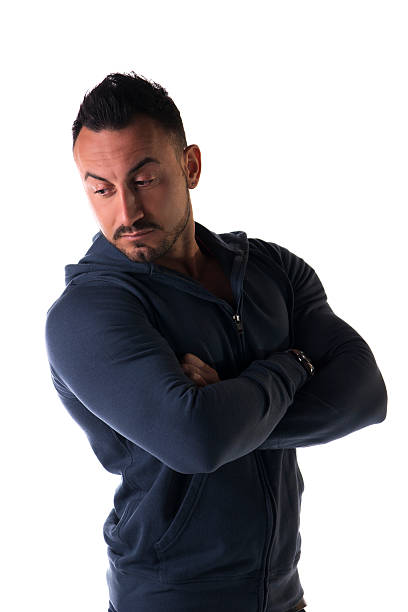istock Muscular man with sweatshirt, arms crossed on his chest, looking 532918793