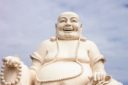 A chubby white buddha statue, in Vietnam