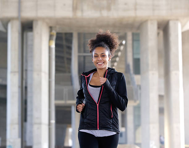 istock Happy young woman running exercise 532920331