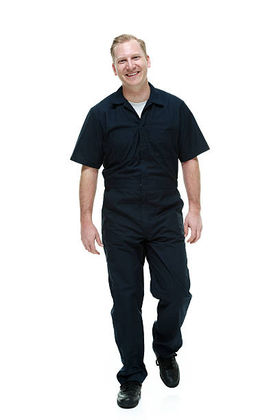 istock Cheerful mechanic looking at camera & walking 532934631