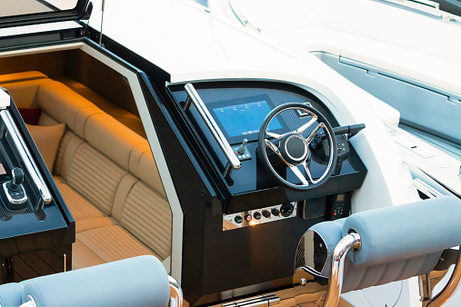 Detail of luxury speedboat dashboard and cabin, full frame horizontal composition