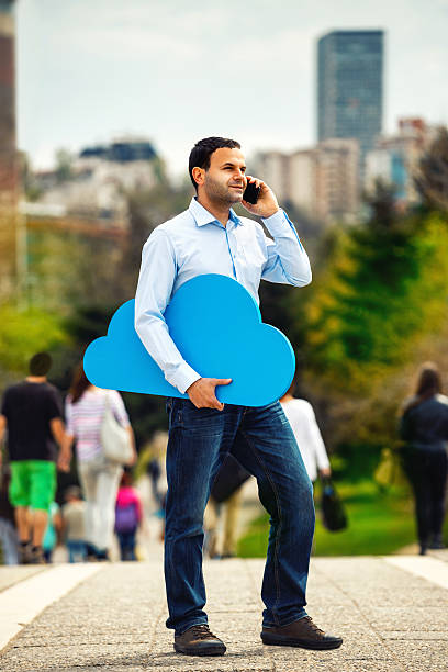 istock Young man with big blue cloud outdoors 532937167