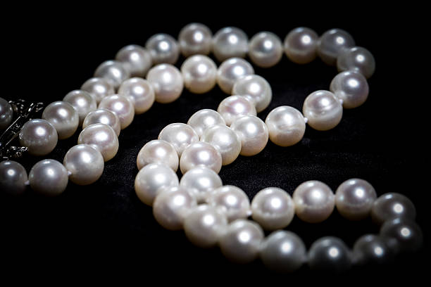 istock Pearl necklace against a dark background 532938029