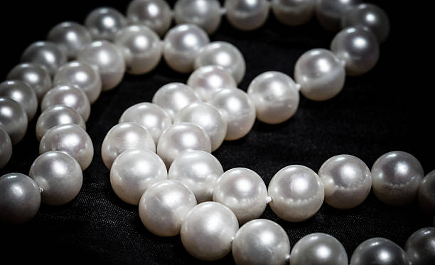 istock pearl necklace on black background 532938187
