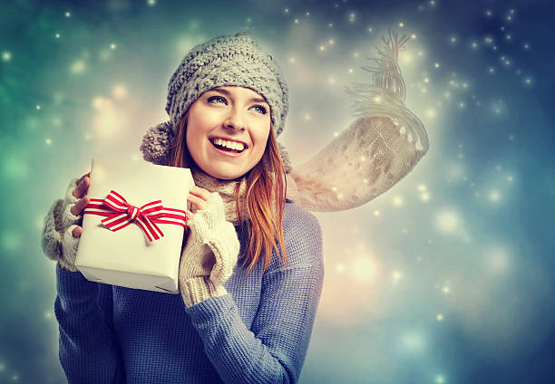 istock Happy young woman holding a present box 532938743
