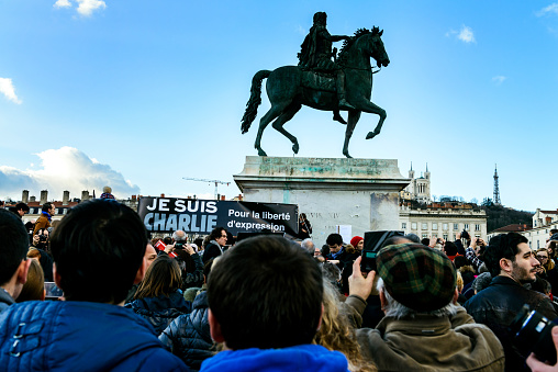 Lyon, France - January 11, 2015: demonstration in solidarity with the attack against Charlie Hebdo in Lyon, France on 11 January, people holding a sign. 