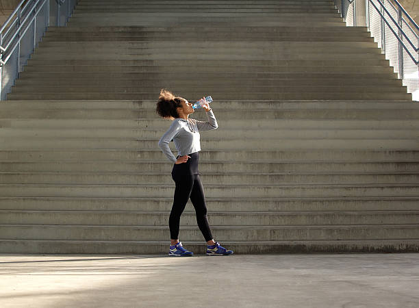 istock Sport woman drinking water from bottle 532940817