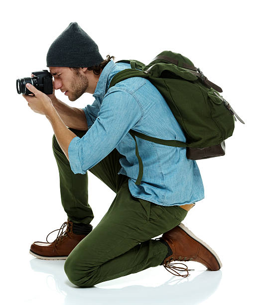 istock Photographer in action with camera 532948296