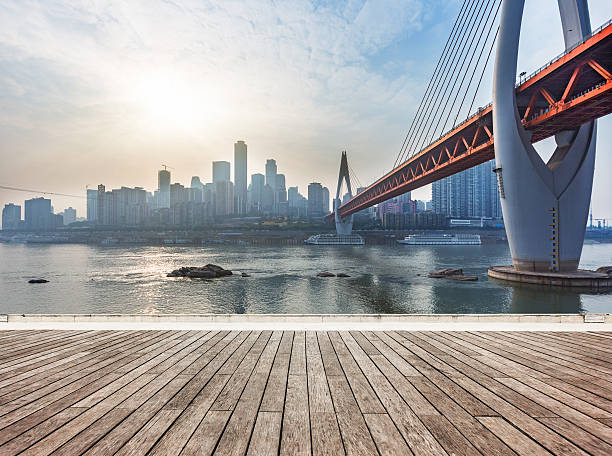 vista de los edificios de la ciudad, el río y puente durante la puesta del sol - architecture asia bridge city fotografías e imágenes de stock