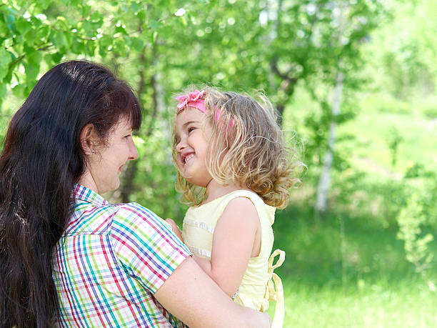 istock mother playing with her  little daughter on nature 532950532