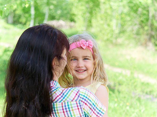 istock mother playing with her  little daughter on nature 532950590