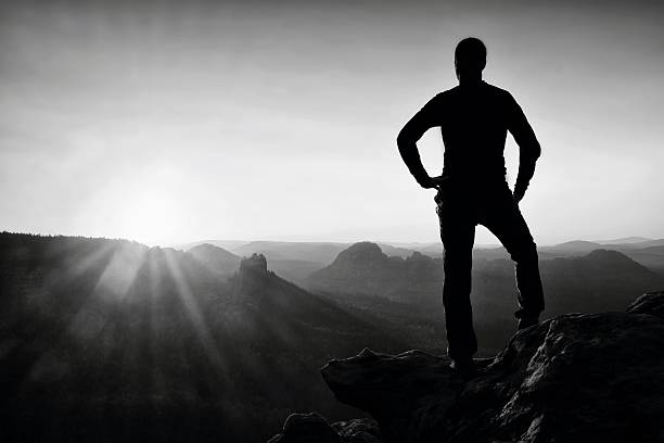 istock Man has his hands on  hips in nature at daybreak. 532952662