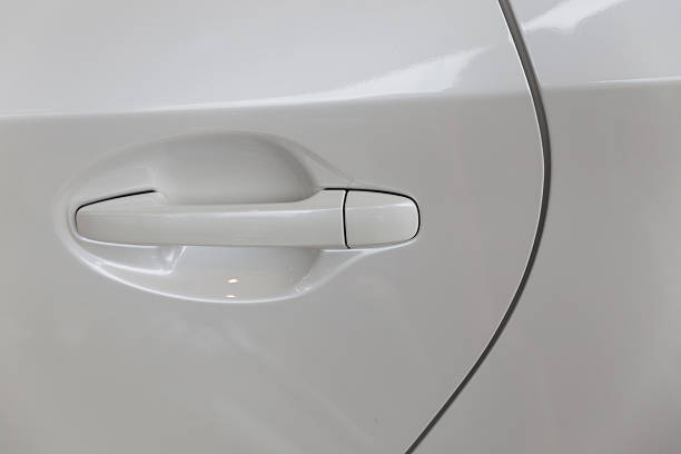 istock door handle of new white car 532952912