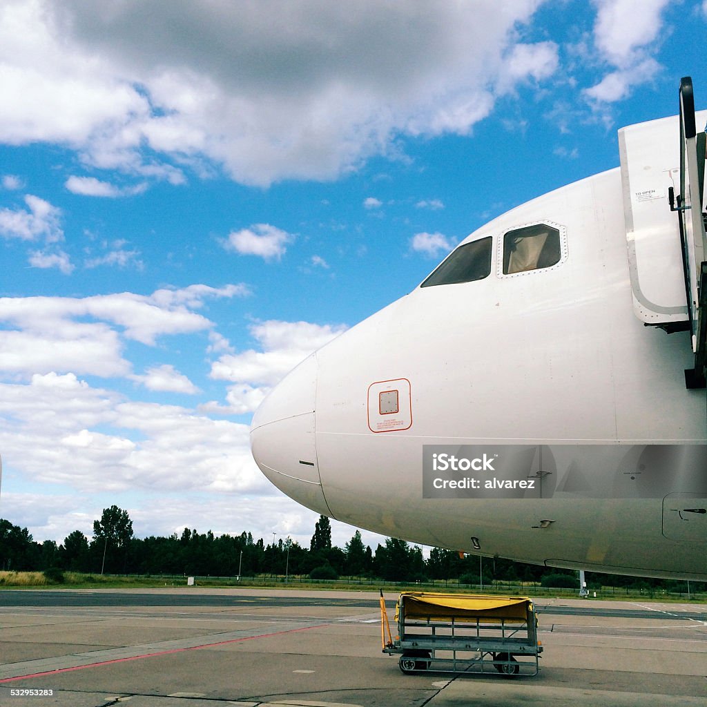 Airplane parked in an airport Cockpit nose of an airplane parked in an airport 2015 Stock Photo