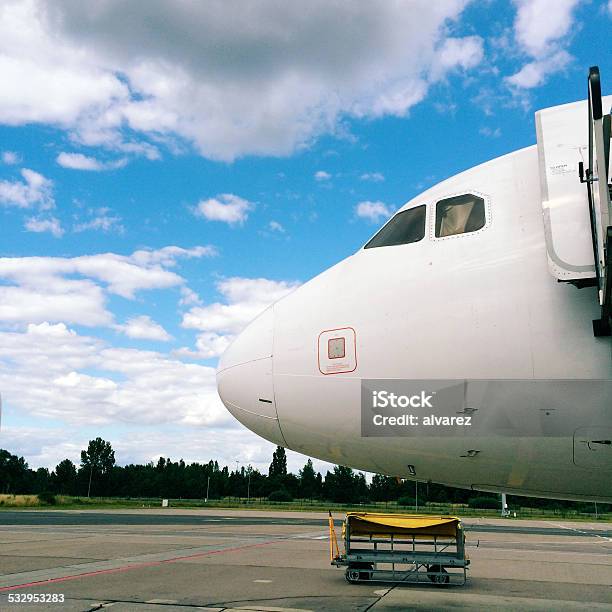 Airplane Parked In An Airport Stock Photo - Download Image Now - 2015, Air Vehicle, Airfield