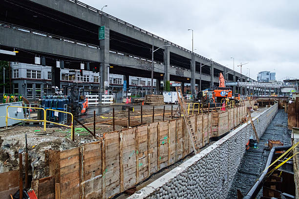 Seattle Seawall replacement Seattle, USA May 21 2016: Construction site for the replacement of the sewall with Alaskan Way Viaduct looming background elliott bay photos stock pictures, royalty-free photos & images