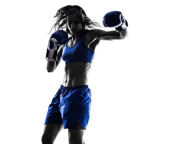istock woman boxer boxing kickboxing silhouette isolated 532954329