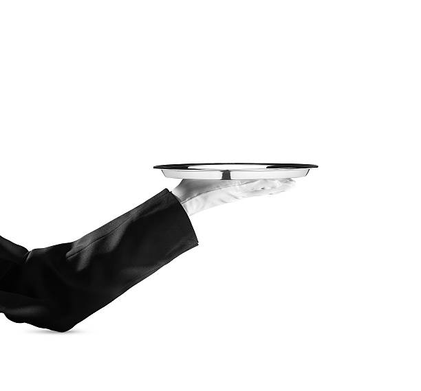 Waiter - Stock Image A waiter holding an empty silver platter.  formal glove stock pictures, royalty-free photos & images