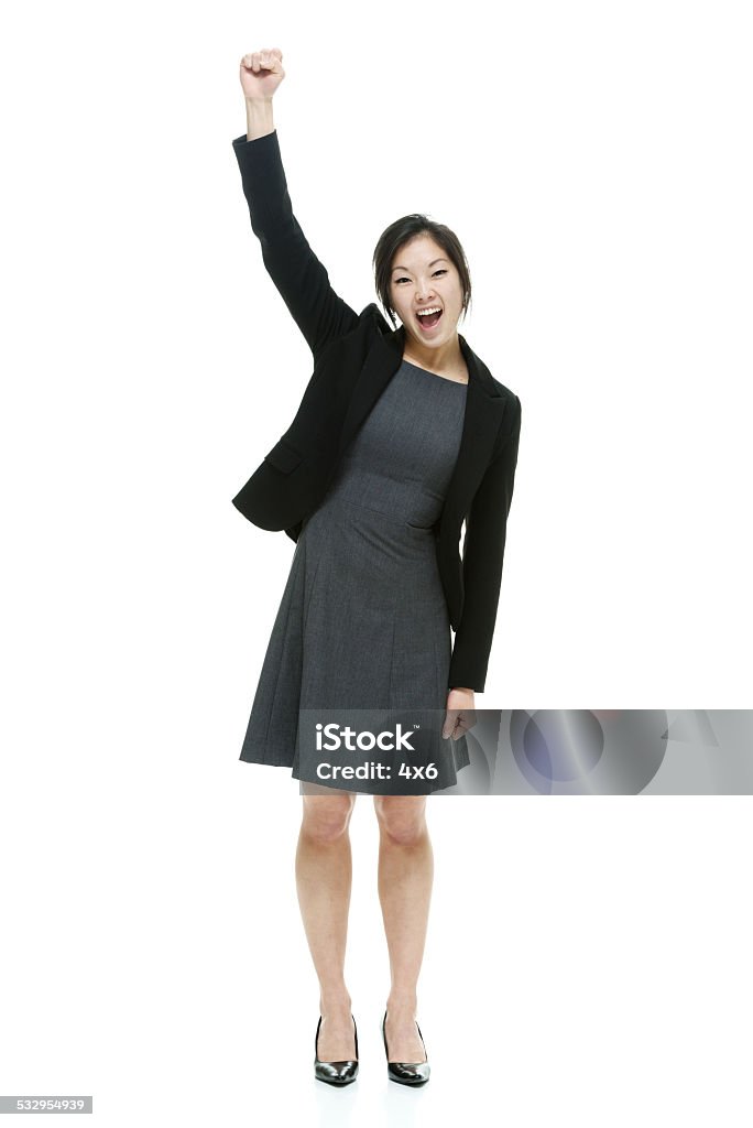 Cheerful businesswoman cheering Cheerful businesswoman cheeringhttp://www.twodozendesign.info/i/1.png Asian and Indian Ethnicities Stock Photo