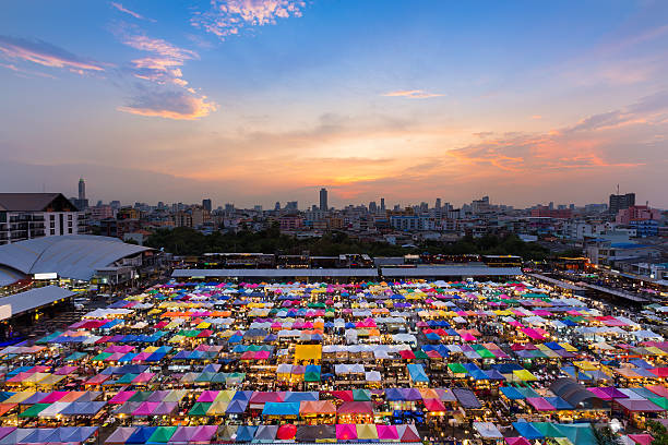 istock Aerial view, multiple colours flea market roof top 532954978