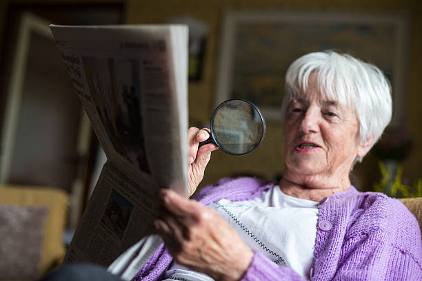 istock Senior woman reading morning newspaper 532955827