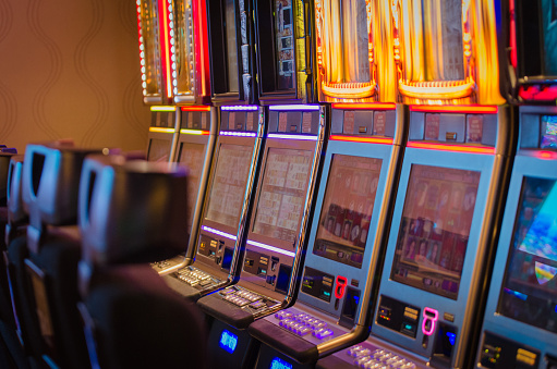Row of slot machines inside a casino.