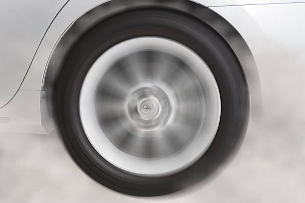 drifting and smoking wheel tire of new white car automobile