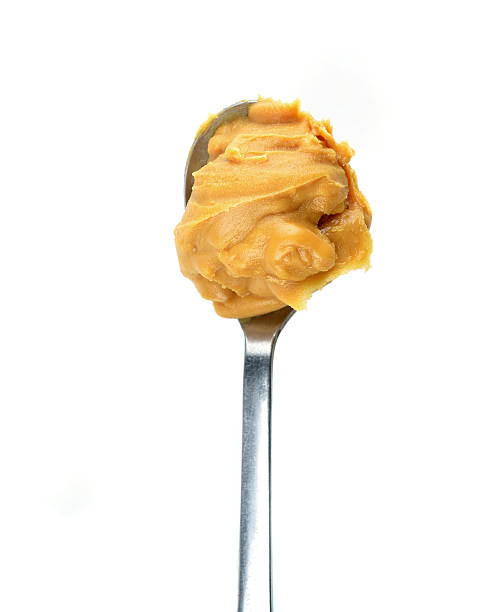 istock Creamy peanut butter in a spoon 532957031
