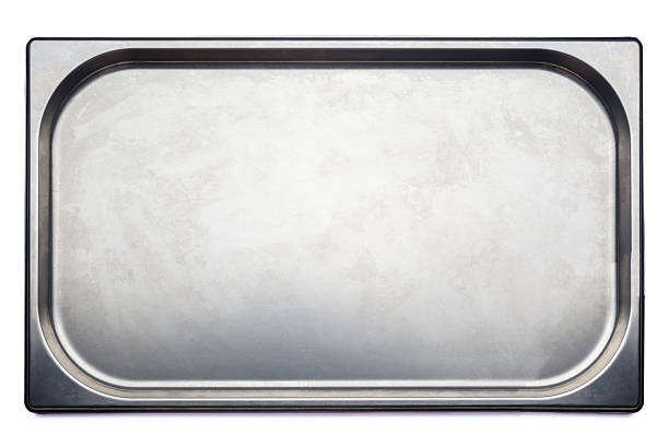Stainless steel medical or kitchen tray with chamfered corners on white background