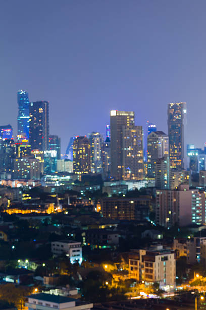 istock Blurred bokeh lights at twilight, office building night view 532958180