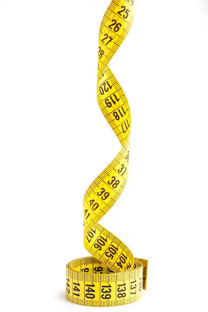 Yellow  measuring tape close-up isolated on white background