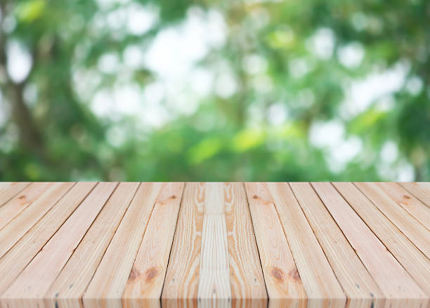 istock Wood table top on blurred bokeh abstract background 532958510
