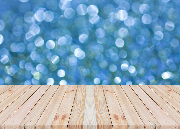 istock Wood table top on bokeh abstract background 532958688