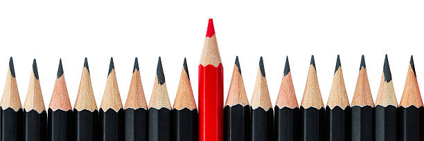 istock Row of black pencils with one red pencil in middle 532959870