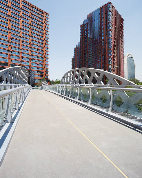 istock footbridge and office building in modern city 532960555