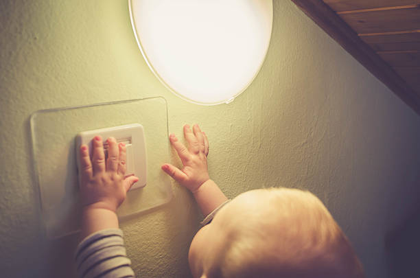 istock Baby child switching on / off the light 532963338