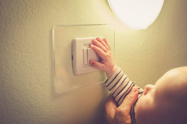 istock Baby child switching on / off the light 532963430