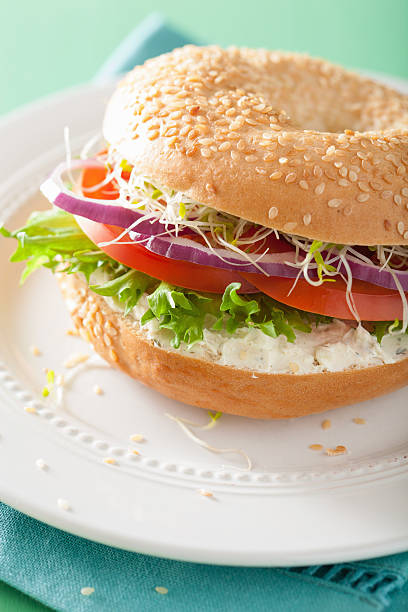 istock tomato sandwich on bagel with cream cheese onion lettuce alfalfa 532964740