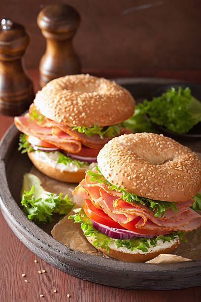istock ham sandwich on bagel with cream cheese tomato onion 532965134